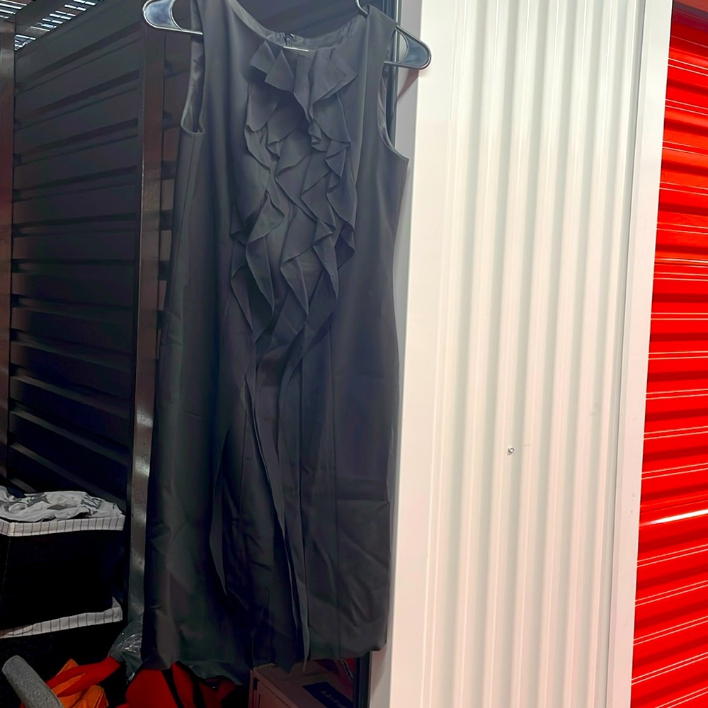 Black dress with beautiful ruffles in front, lined.